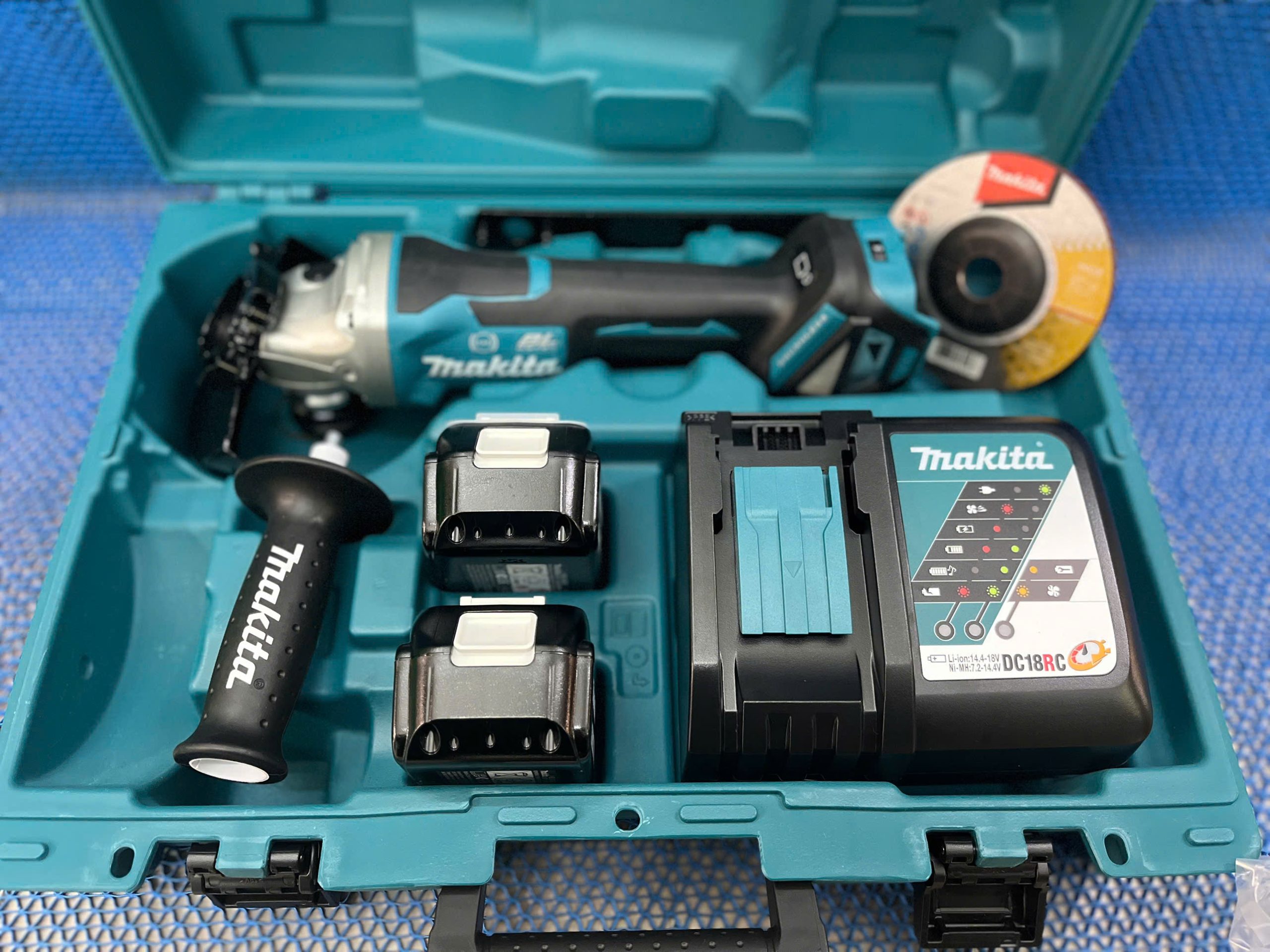 Máy mài góc dùng pin Makita DGA518RTE (125mm/công tắc bóp/AWS/BL) (18V)